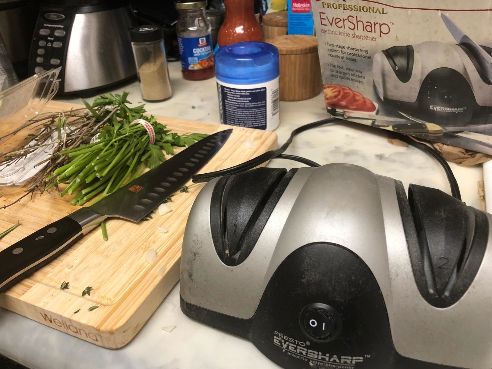 Reviewer image of the sharpener next to a cutting board with a knife