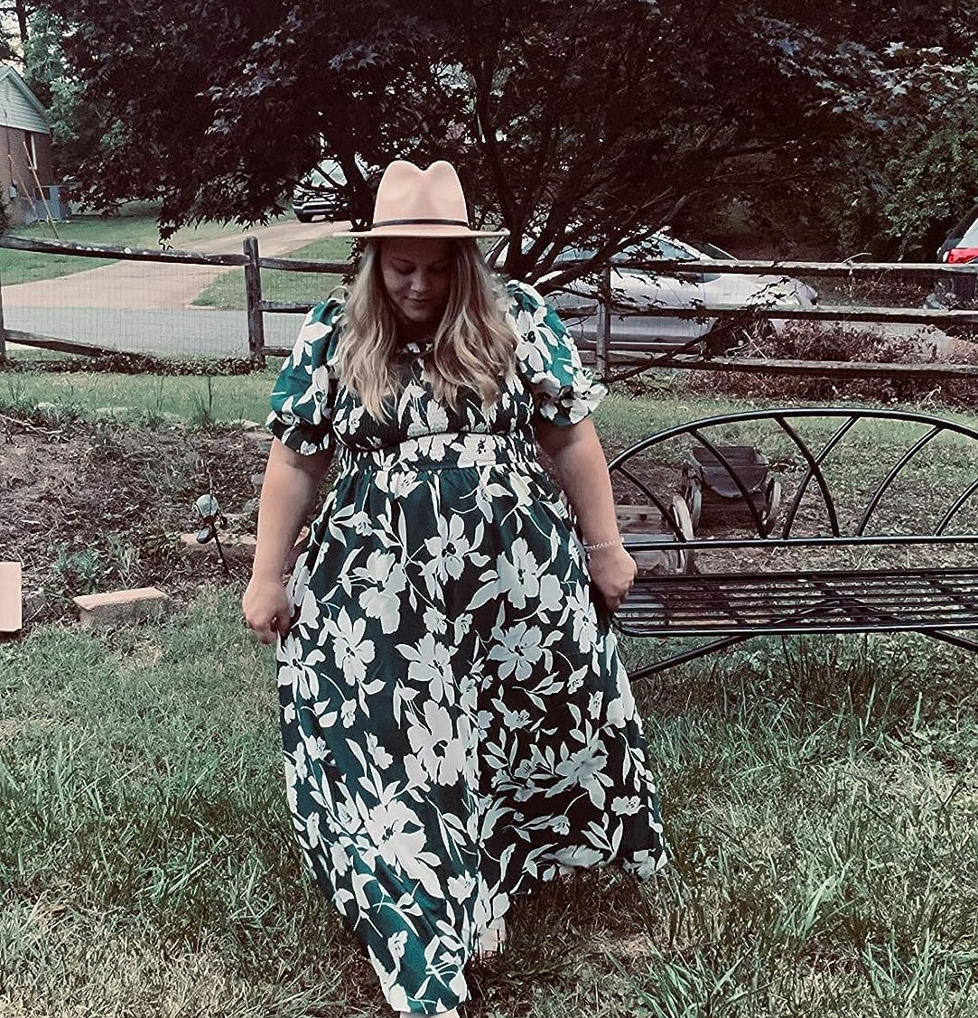 Reviewer wearing the green and white floral print dress