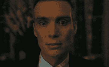 Cillian Murphy stares at an audience with widened eyes in &quot;Oppenheimer&quot;