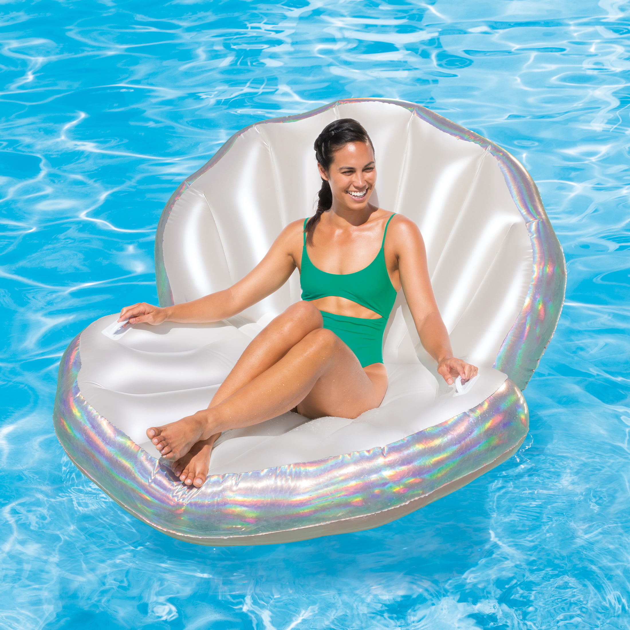 an adult lounging on the pool float in a pool