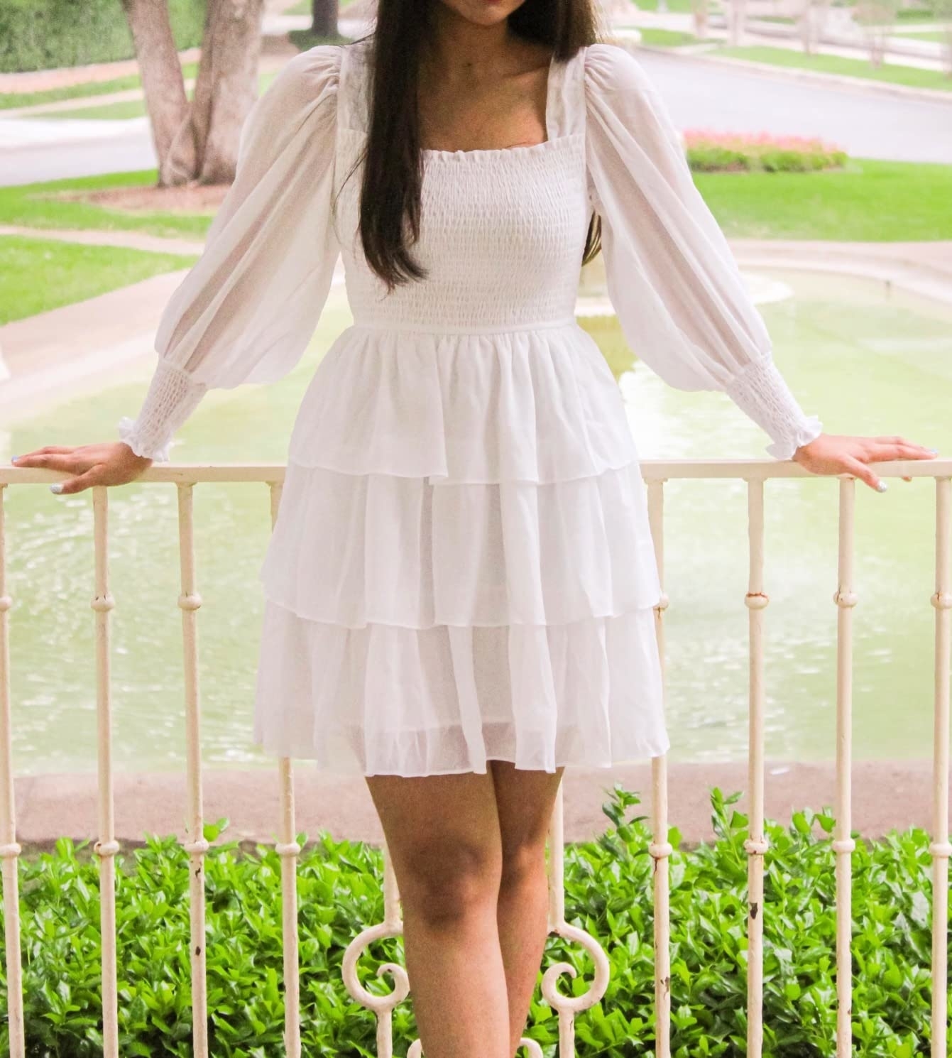 Reviewer wearing the white dress