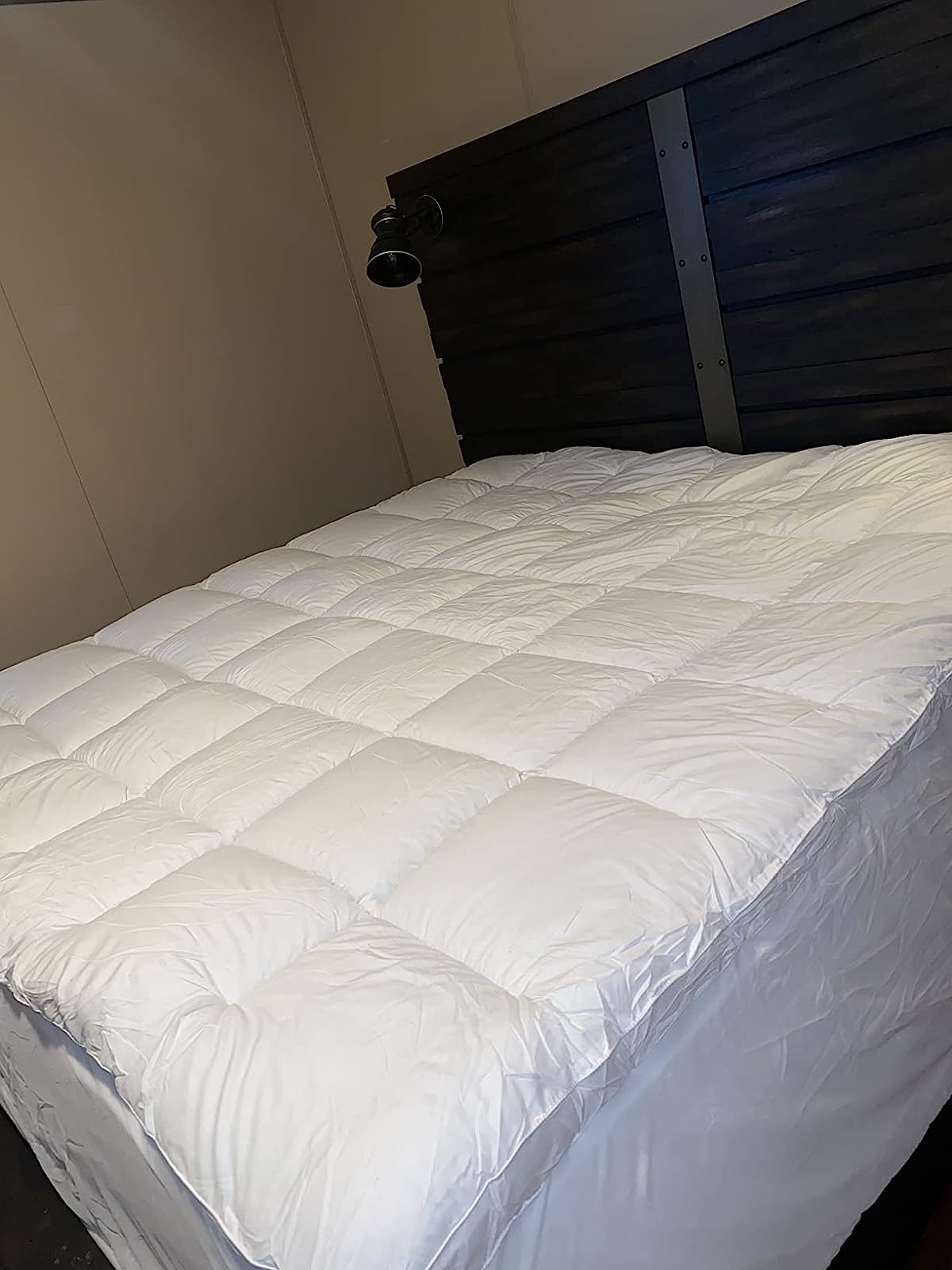 Reviewer image of the mattress topper on their bed