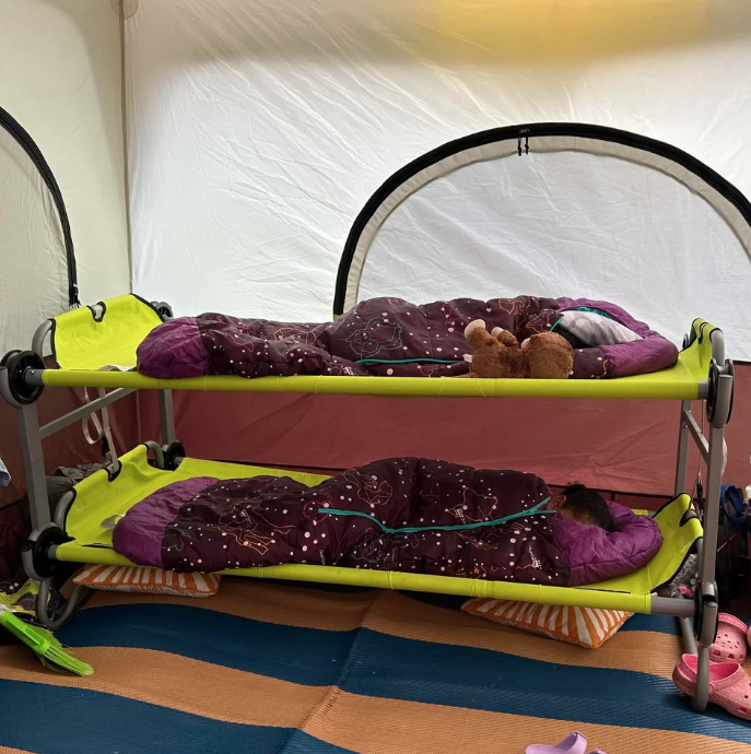 Cots fashioned as bunk beds