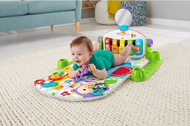 Baby plays on a mat