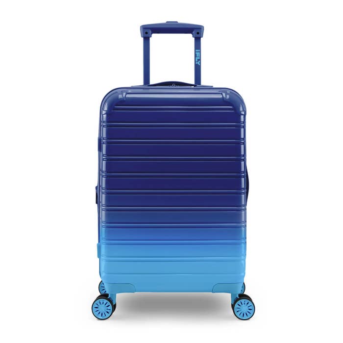 ombré blue suitcase with wheels and handle