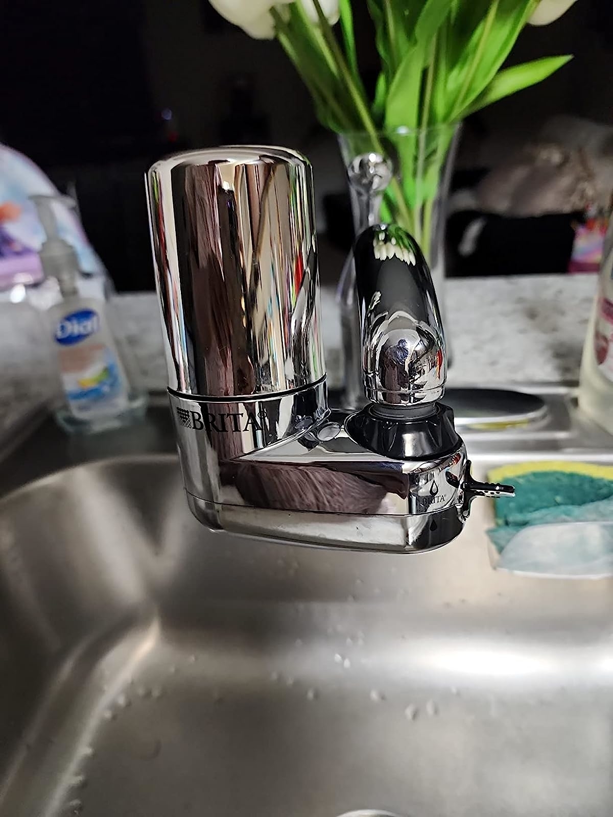 Reviewer image of the filter attached to their kitchen faucet