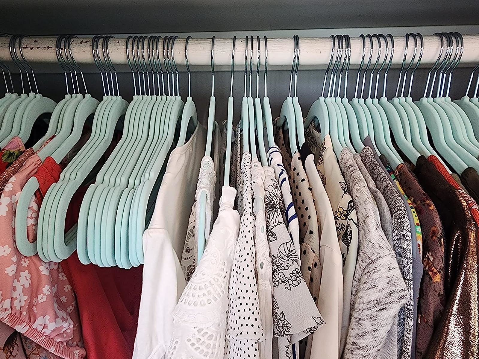 Reviewer image of the blue hangers in their closet