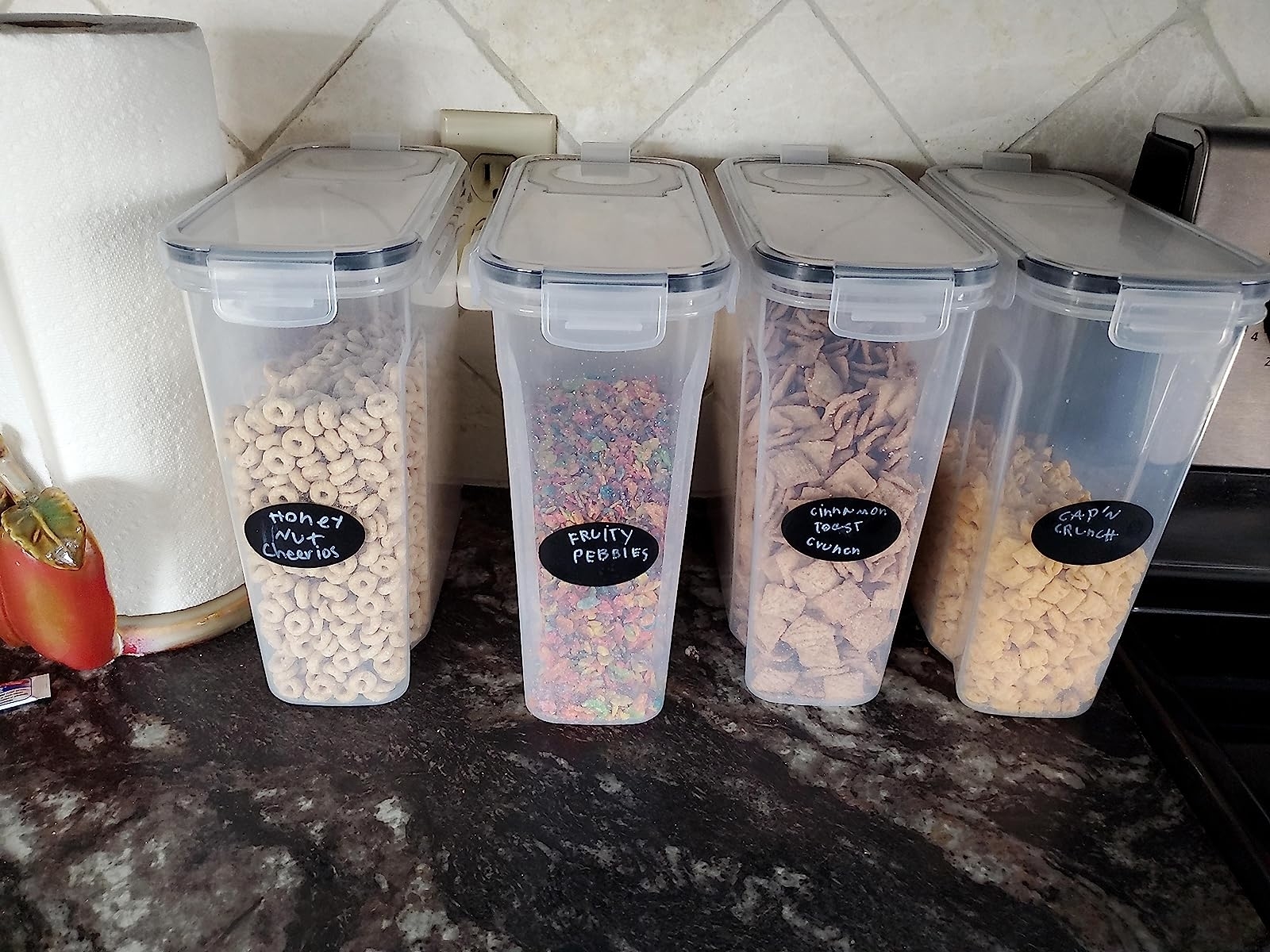Reviewer image of four labeled cereal containers on their countertop
