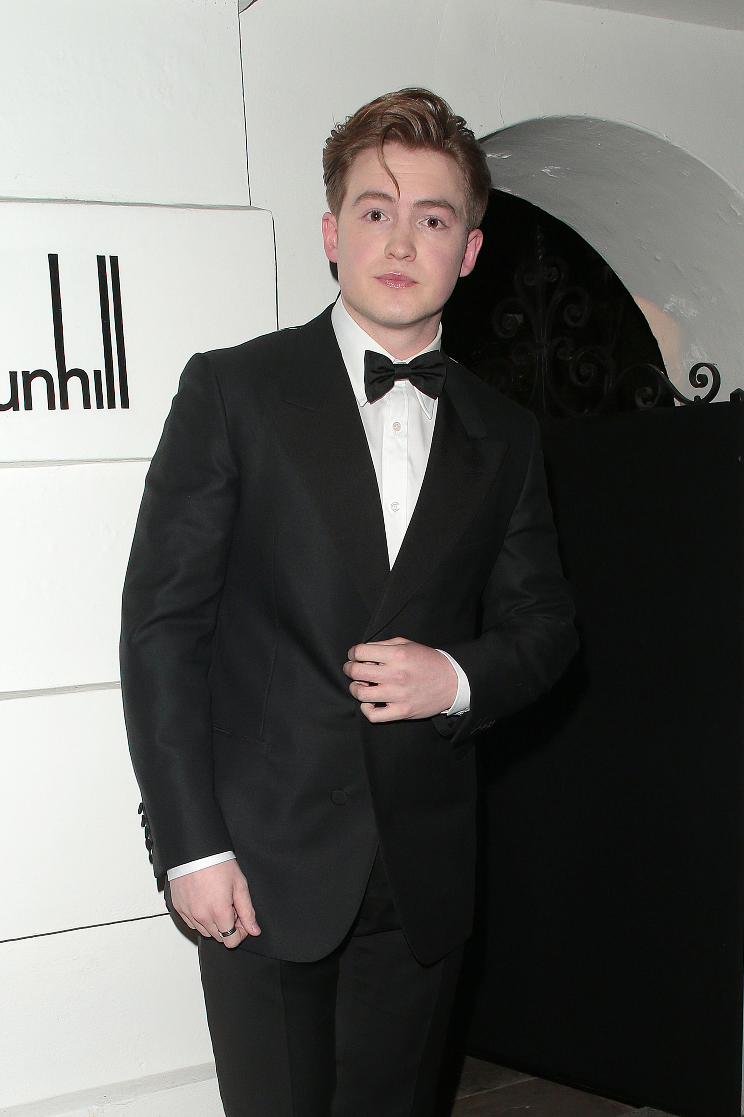 Kit at an event wearing a suit and bowtie