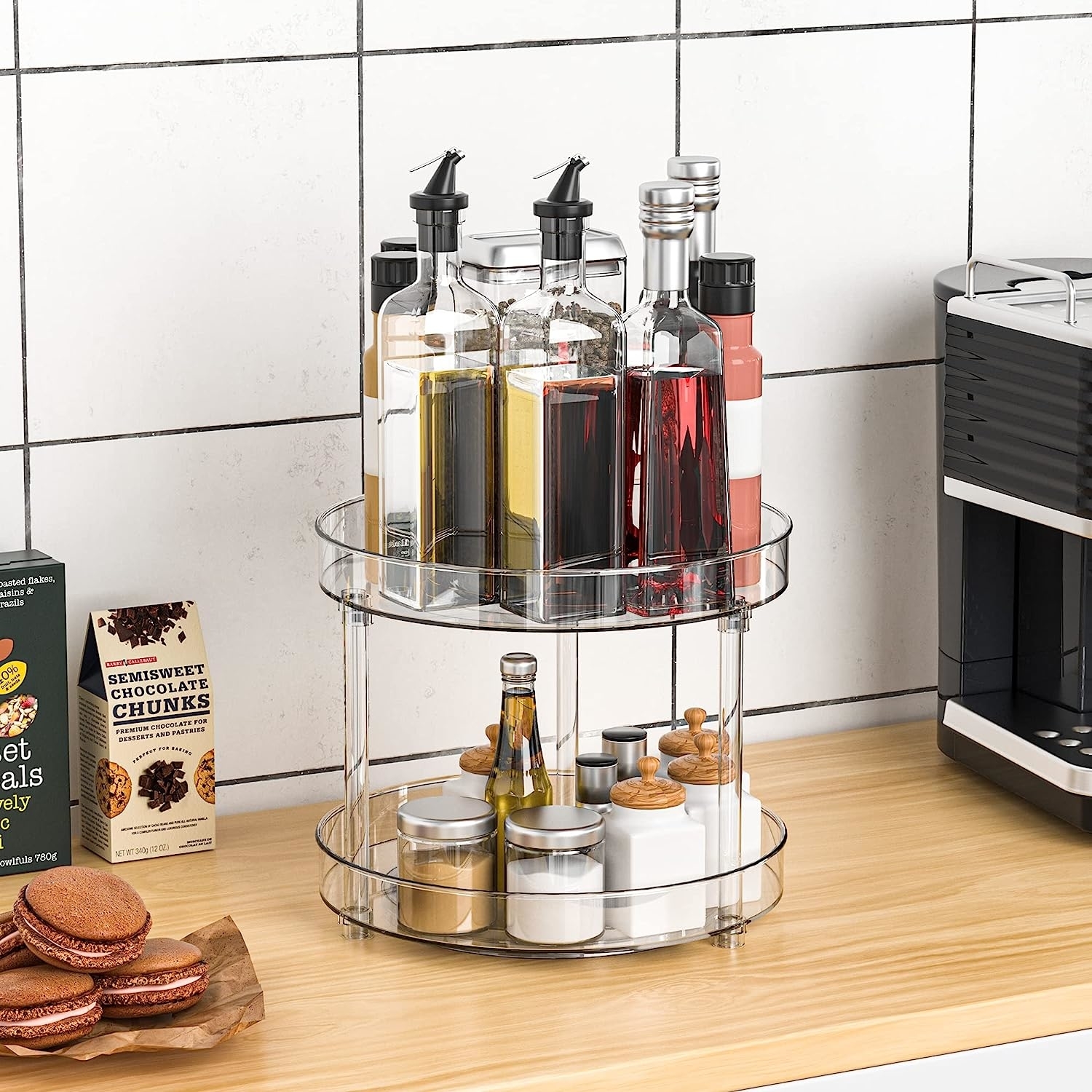 The lazy susan with spices on bottom and oils and condiments on top level