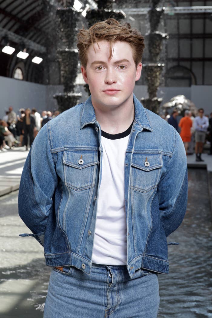 A closeup of Kit Connor in a denim outfit