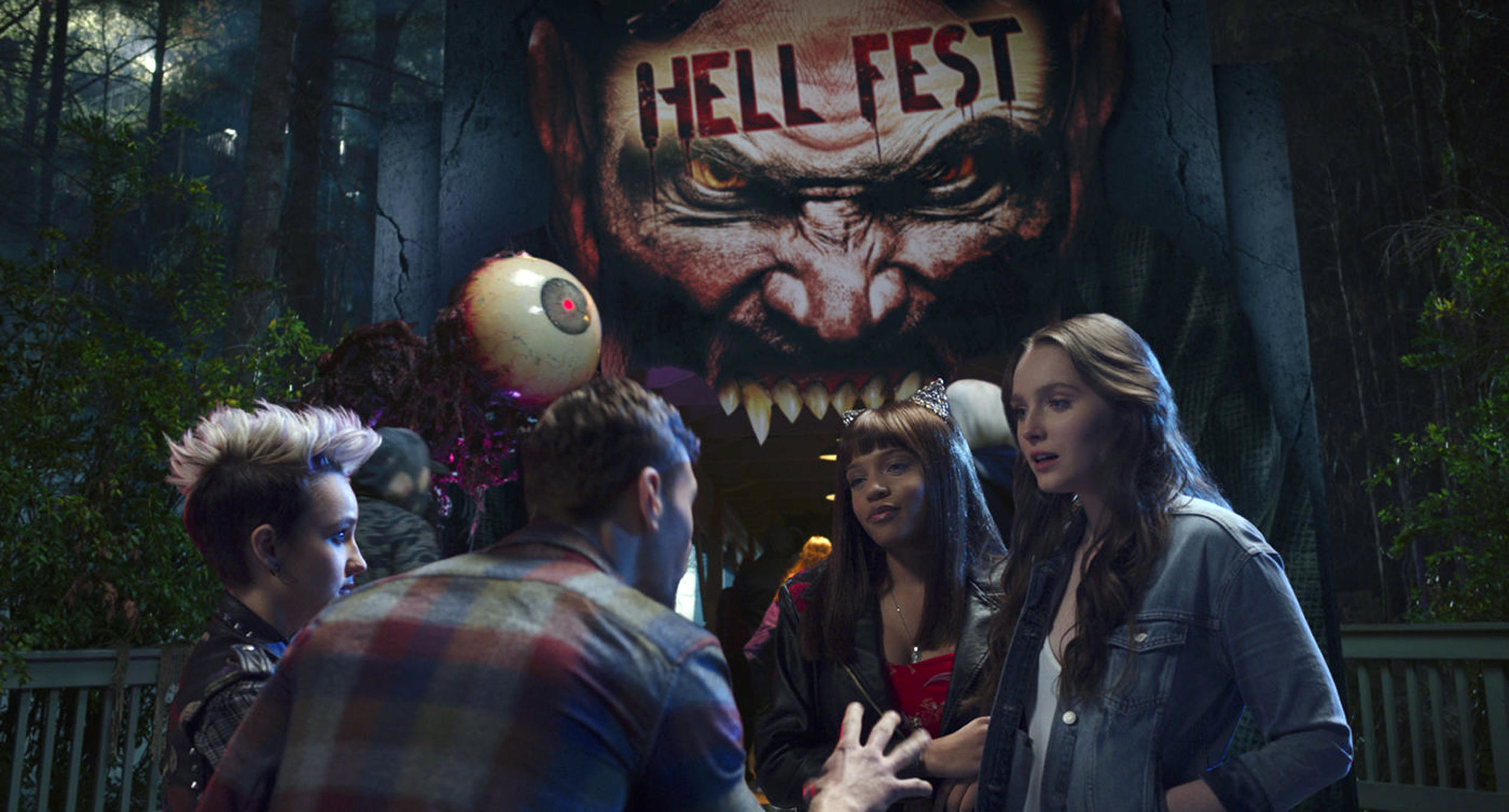 The cast of “Hell Fest” stand near the entrance to “Hell Fest”