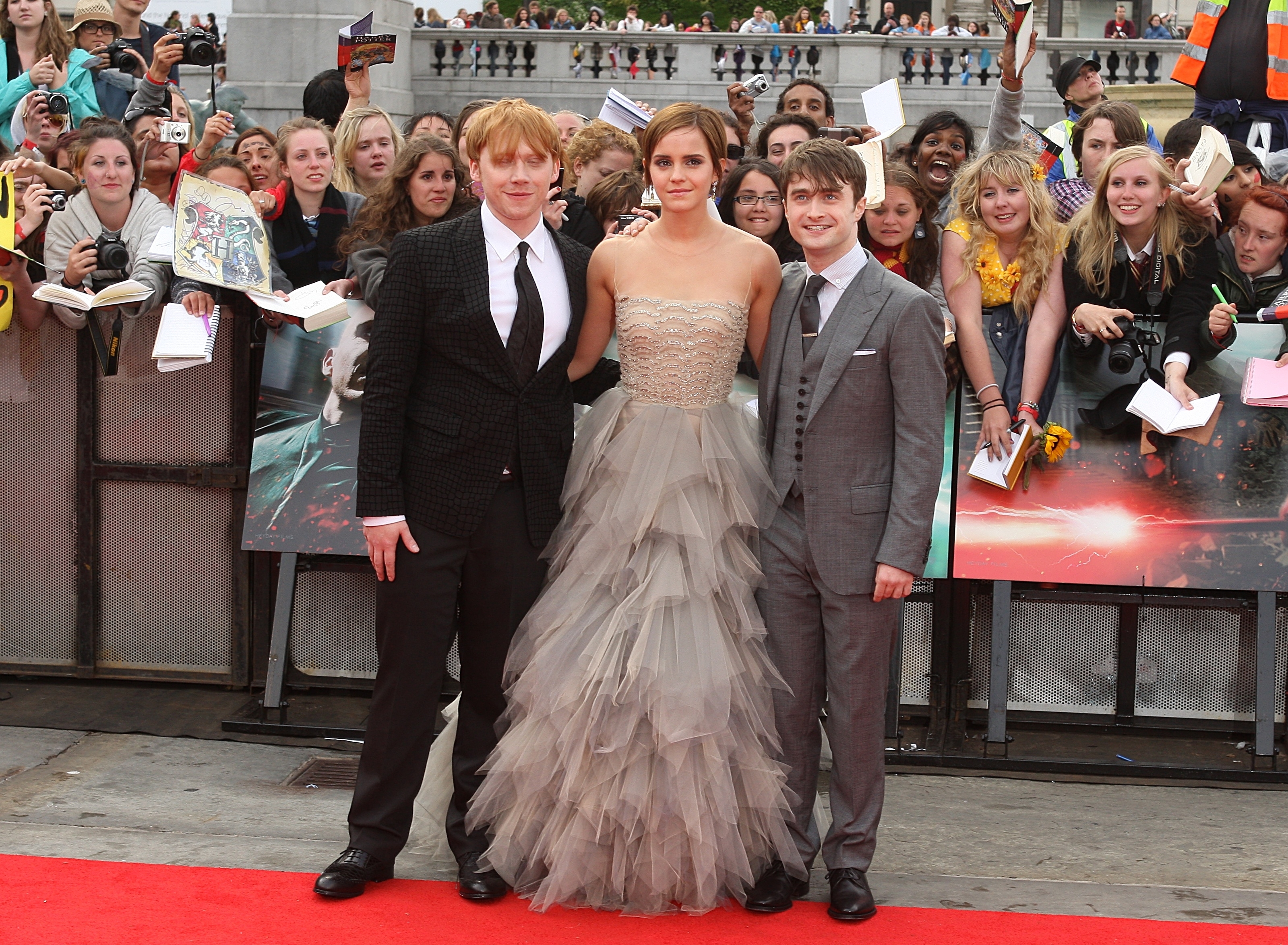 From left to right: Rupert, Emma, and Daniel on the red carpet