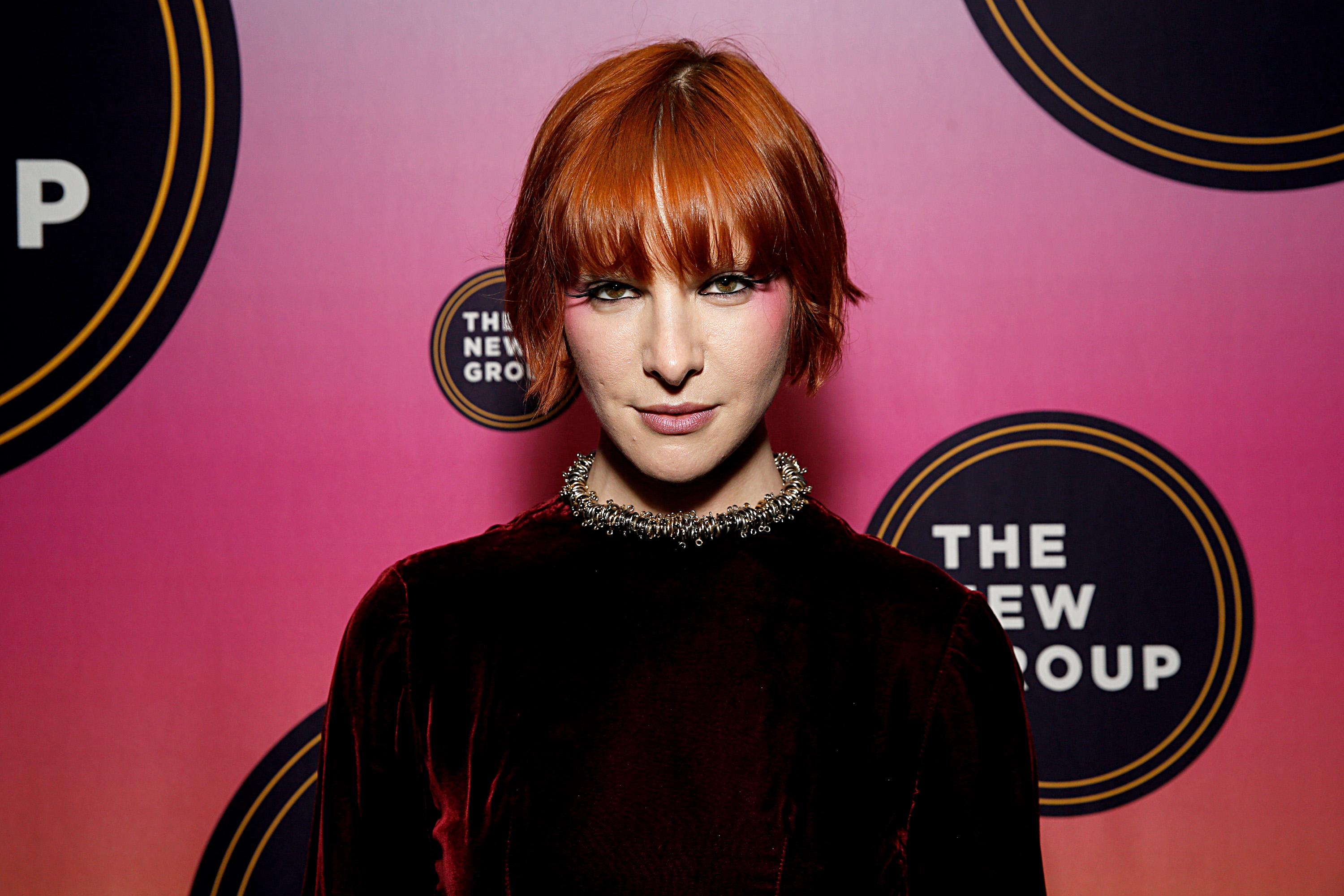 A closeup of Hari on the red carpet of a media event