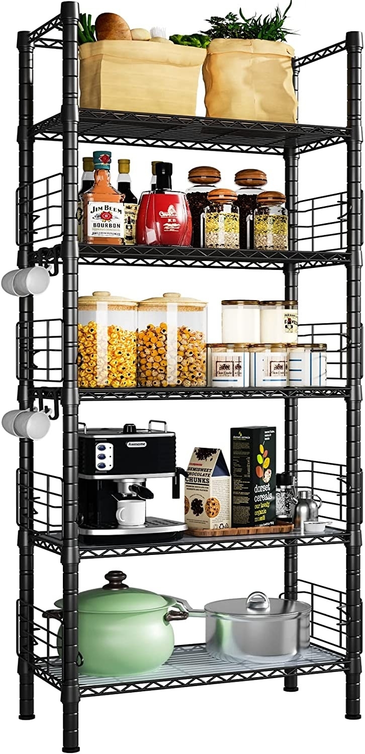 the black five-tier baker's rack with cooking supplies and pantry staples