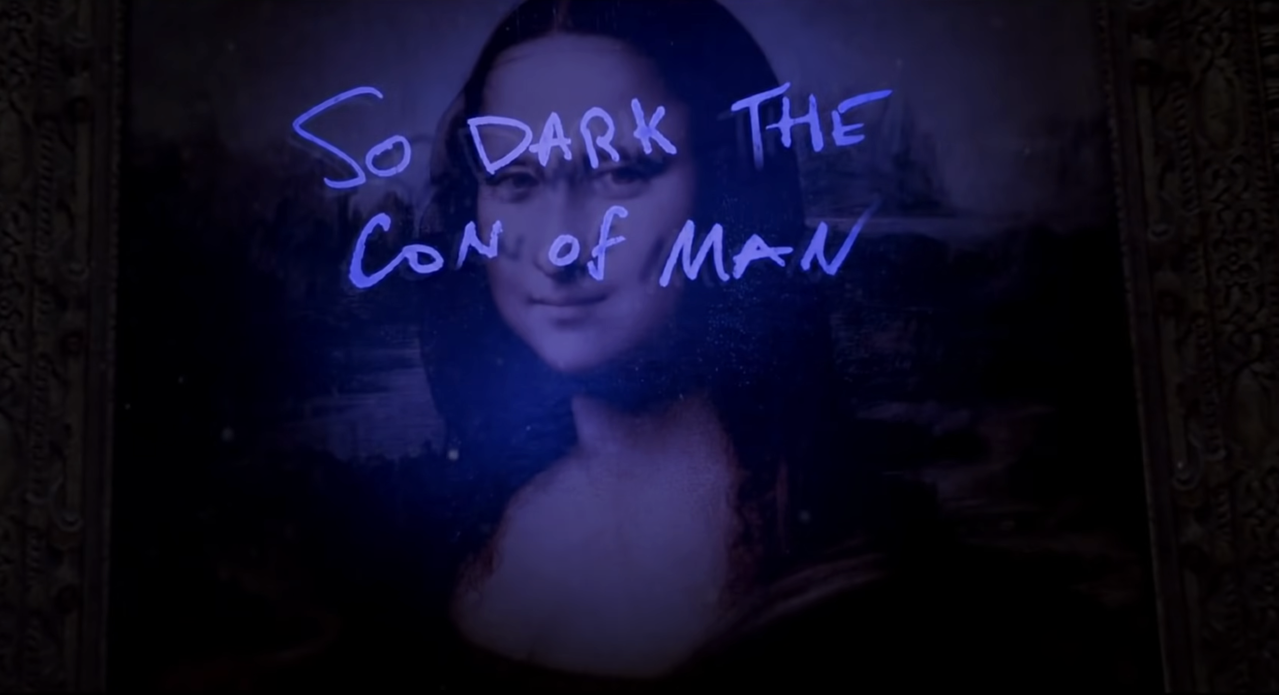 A painting of The Mona Lisa with &quot;So dark the con of man&quot; written on it