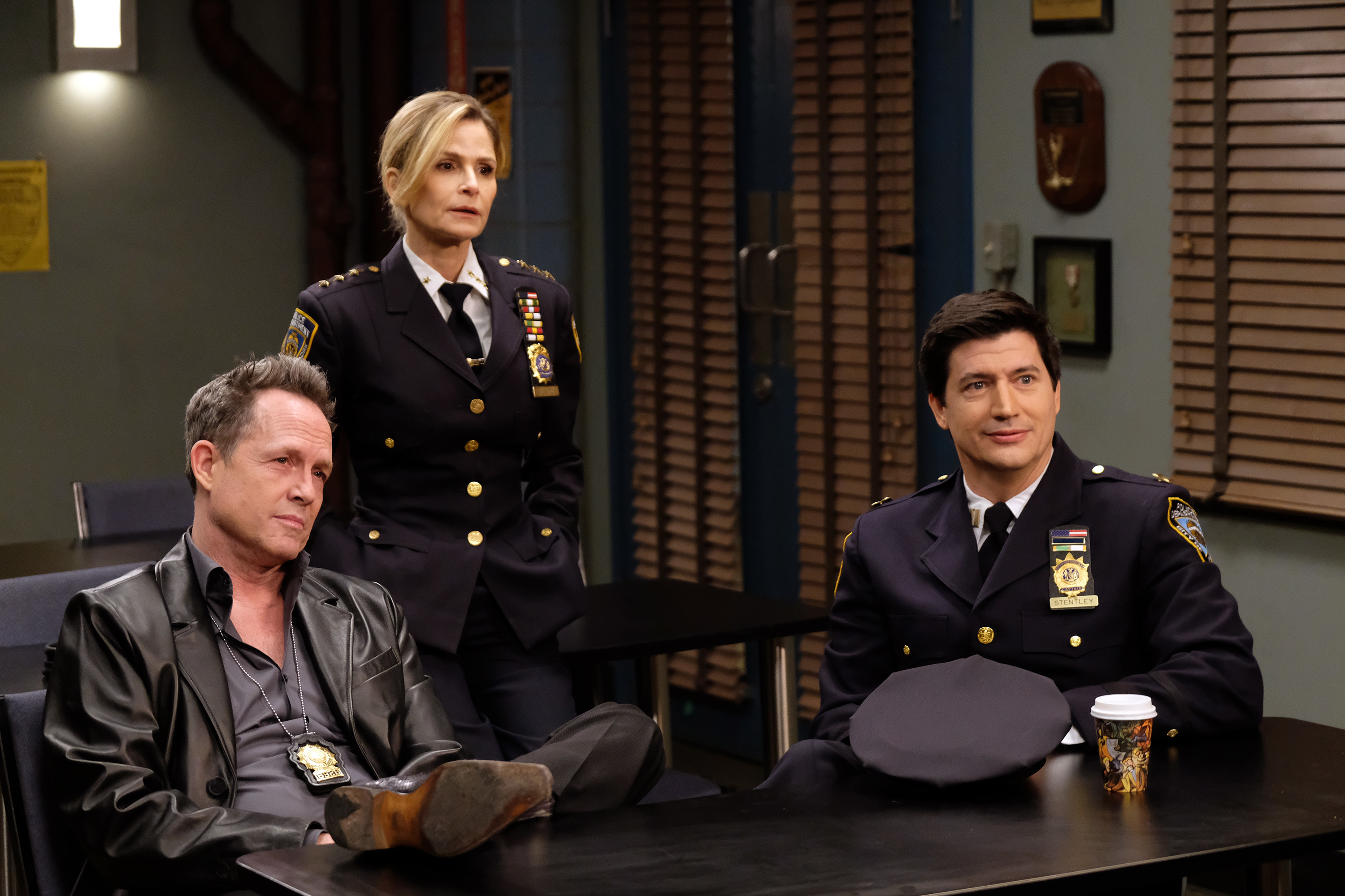 Dean Winters, Kyra Sedgwick and Ken Marino gather around a table