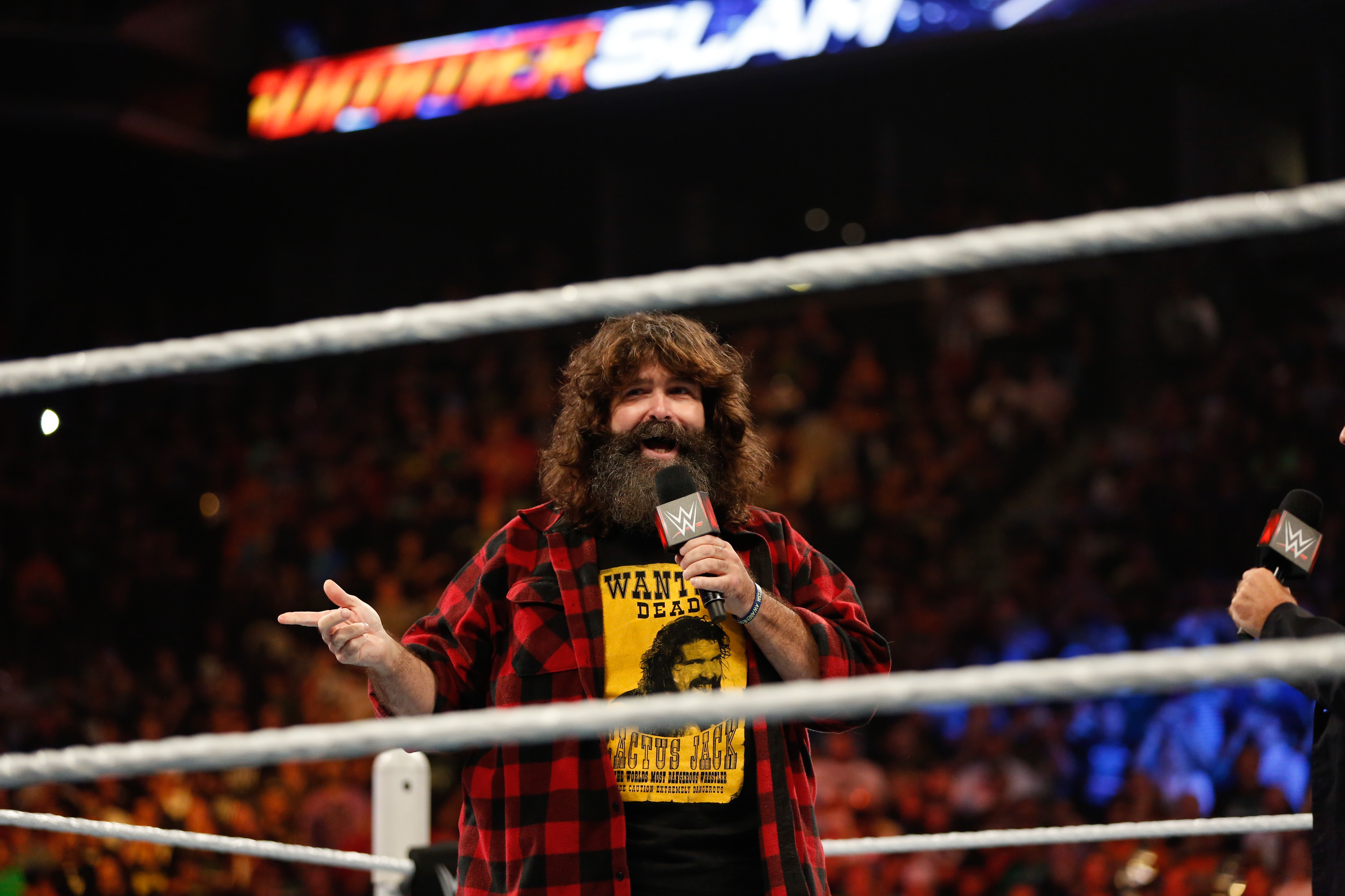 Mick Foley greets the audience at WWE SummerSlam 2015 at Barclays Center of Brooklyn on August 23, 2015