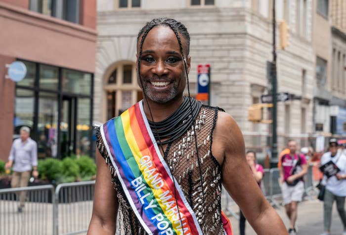 Billy smiling and wearing a Pride &quot;Grand Marshal&quot; sash