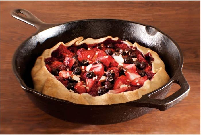 the cast iron skillet with a pie inside