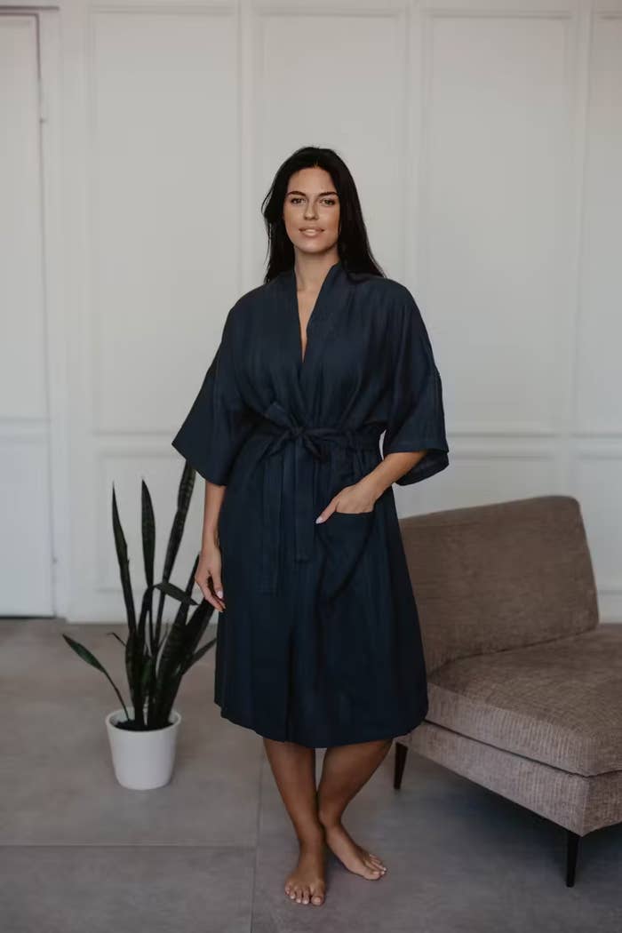 a model wearing the robe in charcoal