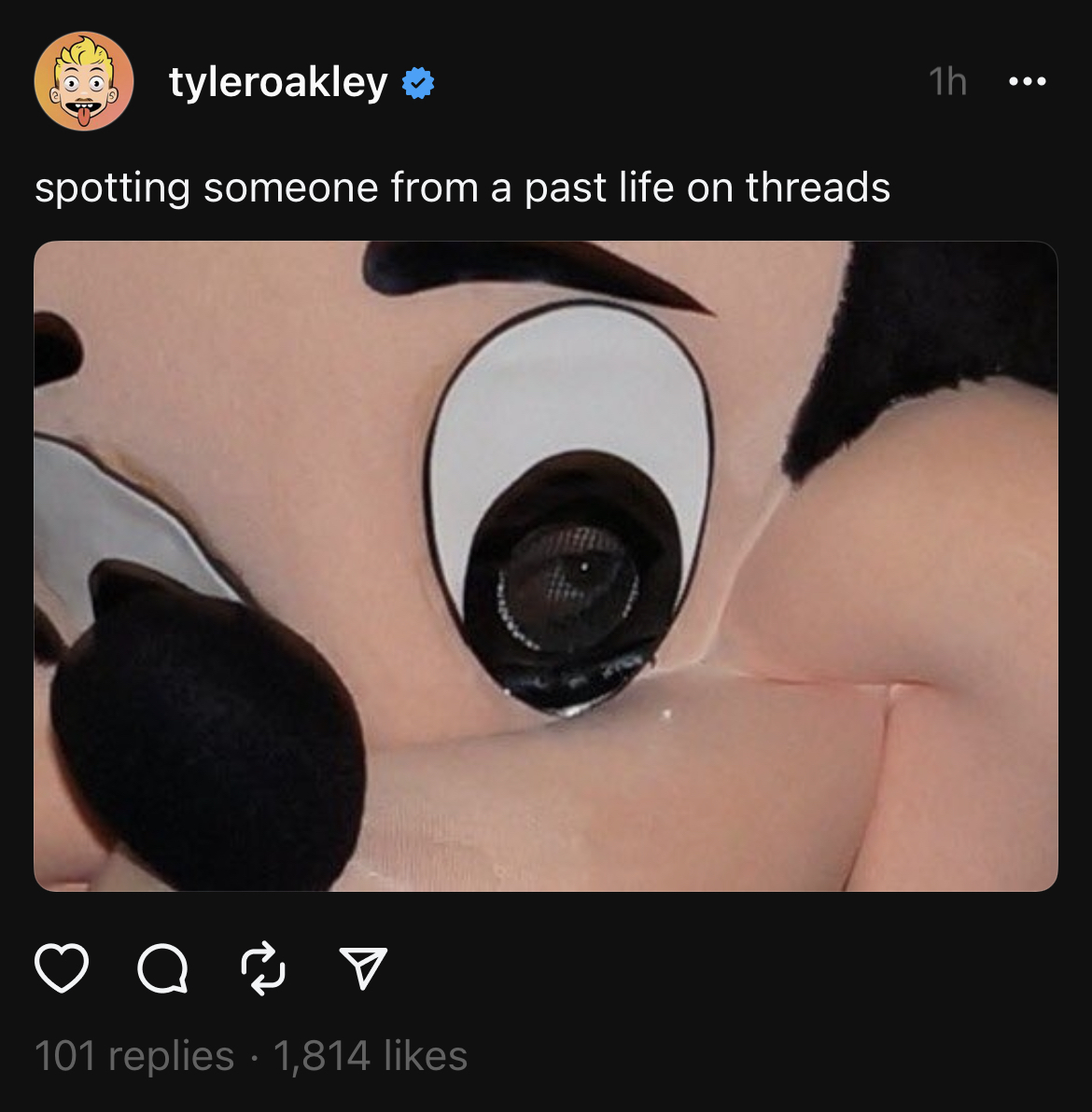 Tyler Oakley thread says &quot;spotting someone from a past life on threads&quot; with a closeup of the eye of the human inside a Mickey Mouse costume