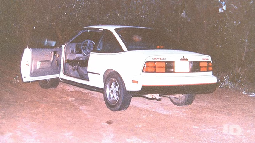 old photo of a car with the driver&#x27;s door opened
