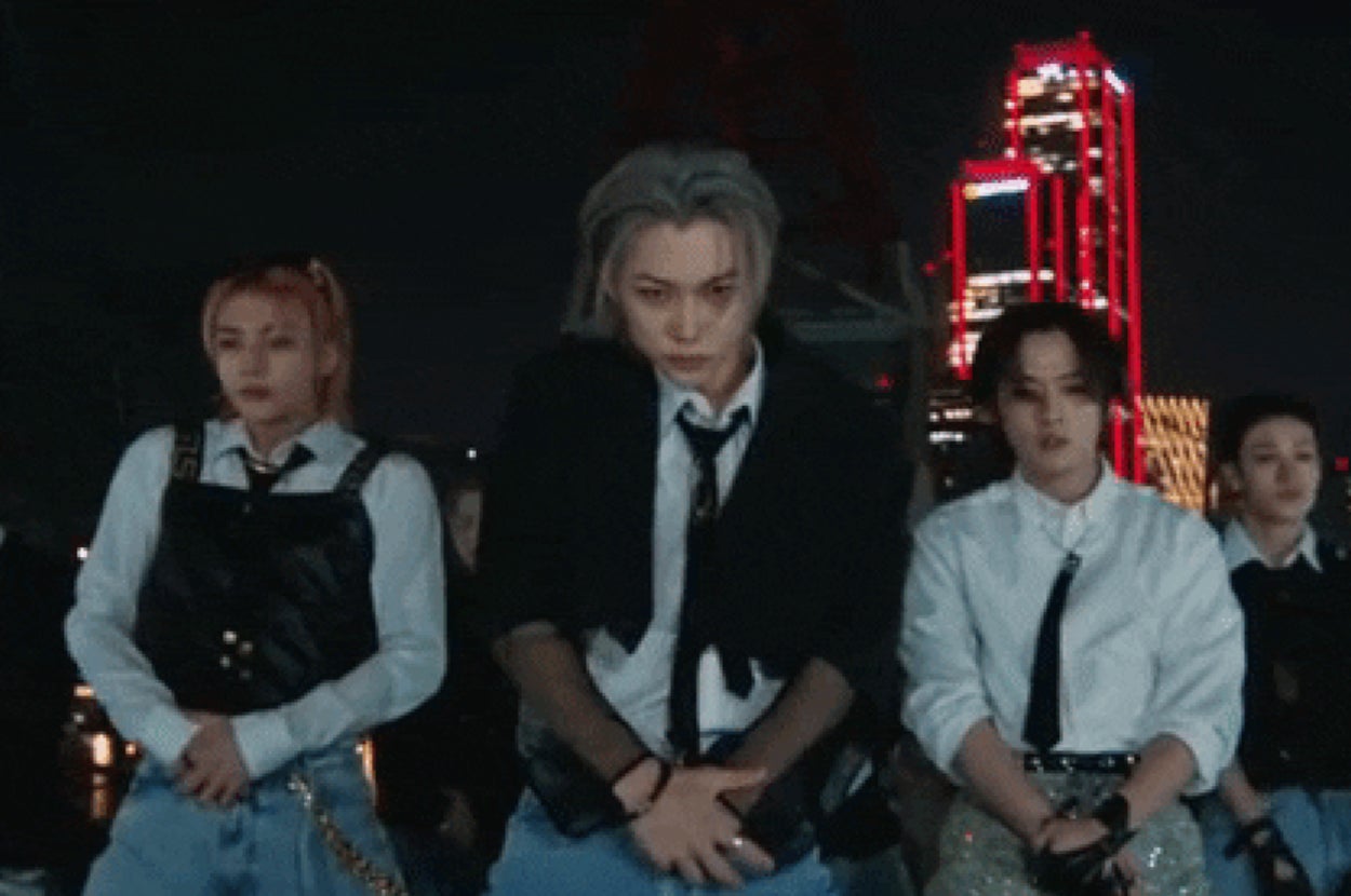 Stray Kids in triangle formation.