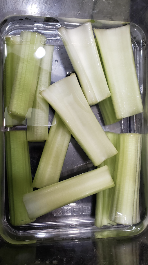 Close-up of pieces of celery in water