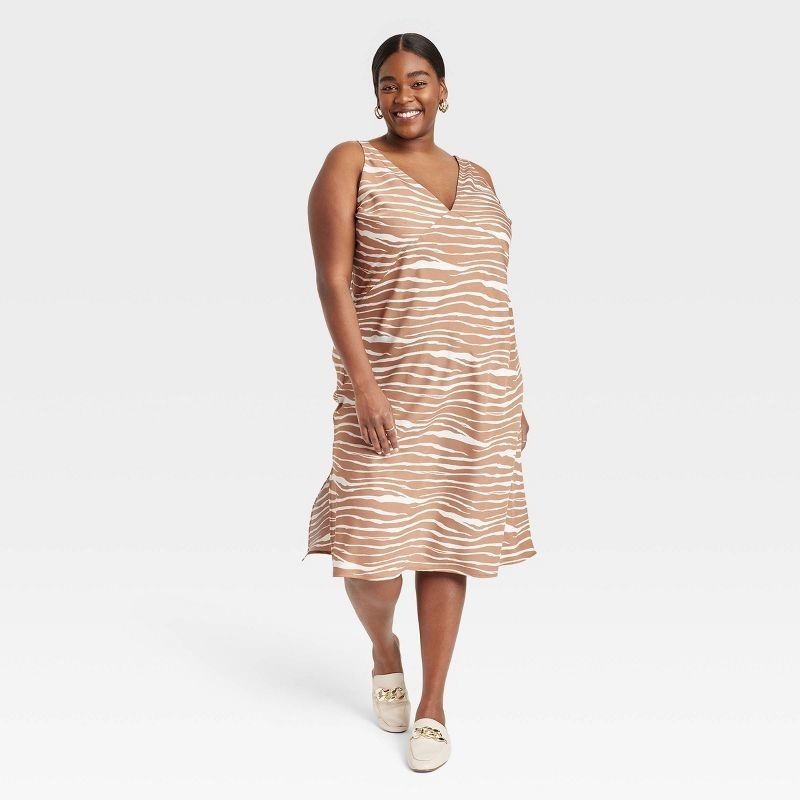 Model wearing the brown striped zebra dress