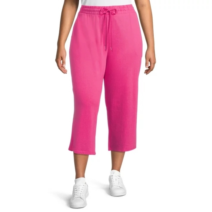 model wearing hot pink capri pants and white sneakers