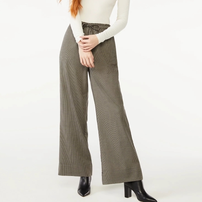 model wearing dark grey wide leg pants with drawstring and black boots