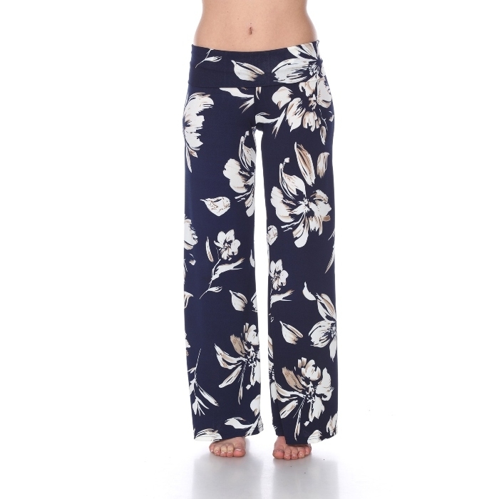 model wearing navy blue wide leg flowy pants with Hawaiian white flower print