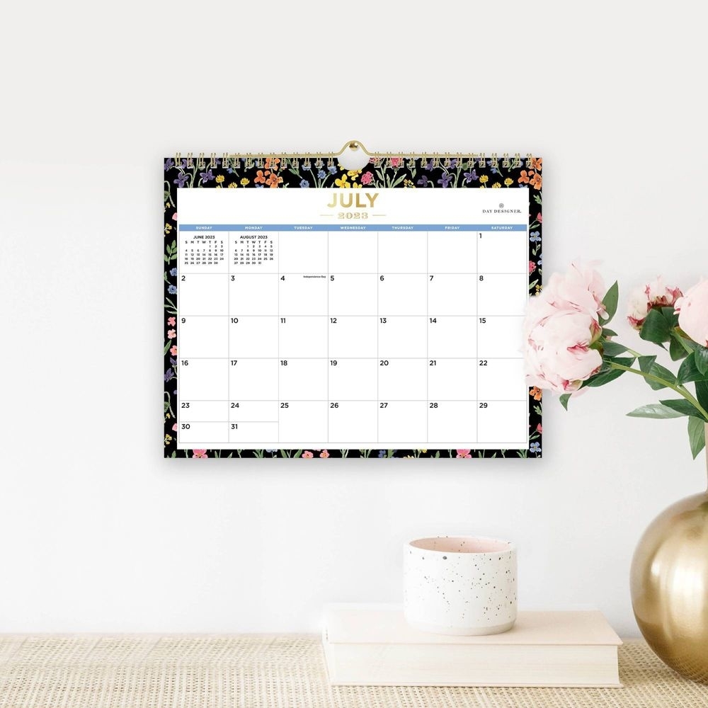 the wall calendar framed in a floral pattern