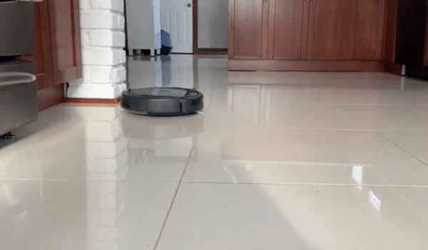 Reviewer's Roomba moving across their kitchen floor