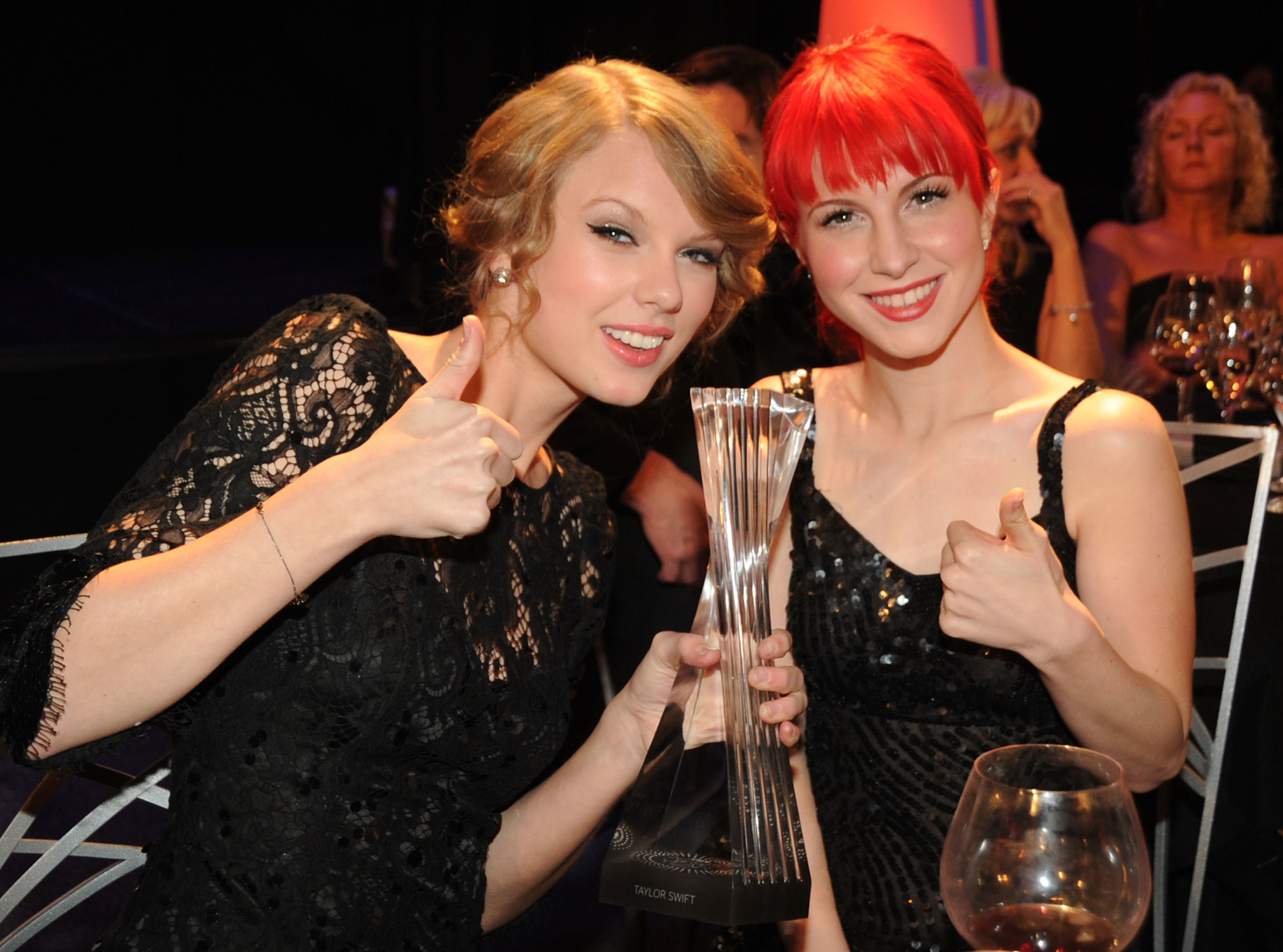 Close-up of Taylor and Hayley sitting together and smiling