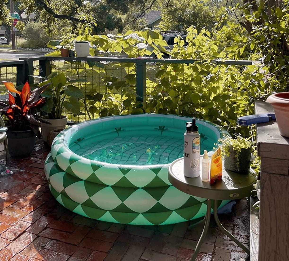 Reviewer&#x27;s blow up pool is on a brick patio