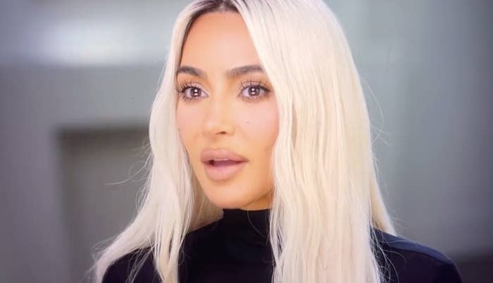 Close-up of Kim with long, platinum blonde hair
