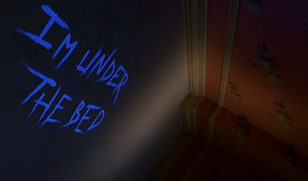 &quot;I&#x27;m under the bed&quot; written on the ceiling in &quot;Idle Hands&quot;