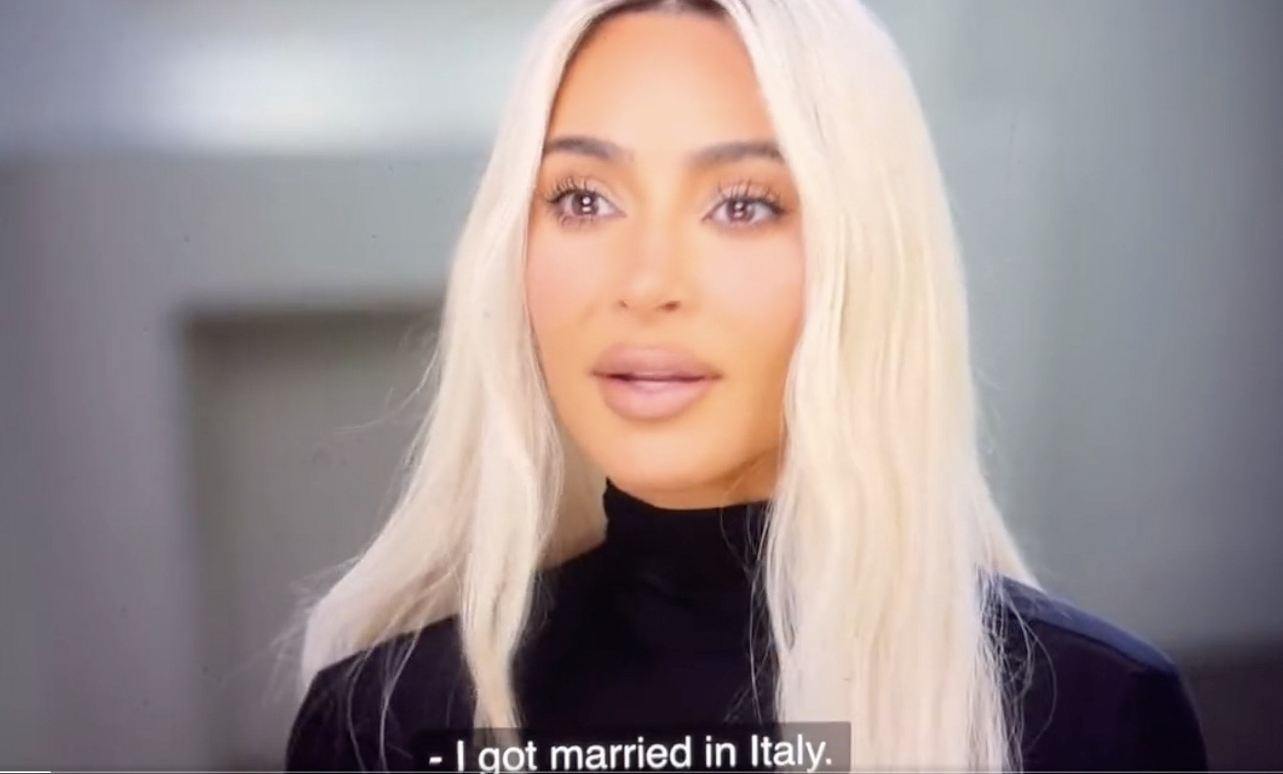 Close-up of Kim with long, platinum blonde hair with caption, &quot;I got married in Italy&quot;