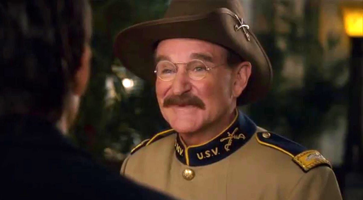 Wiliams as Roosevelt, with round wire glasses and a large hat, in Night at the Museum