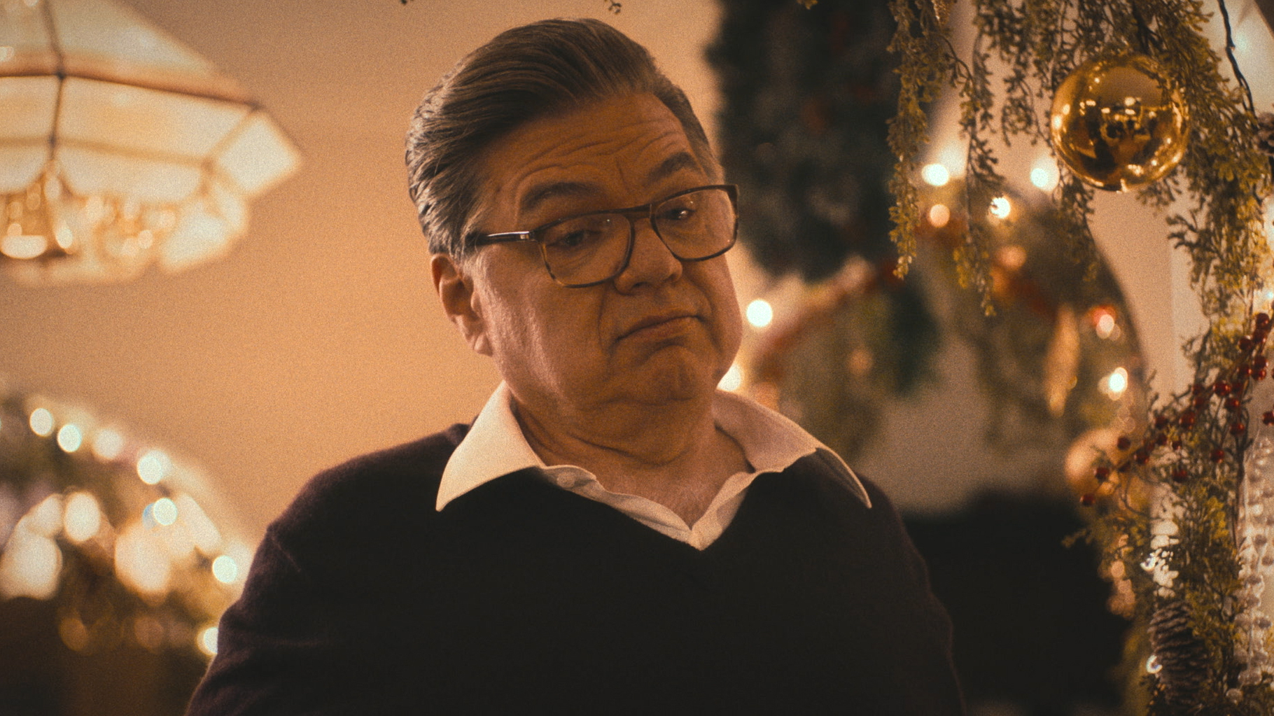 Oliver Platt in glasses, a sweater and collared shirt in a holiday episode of The Bear