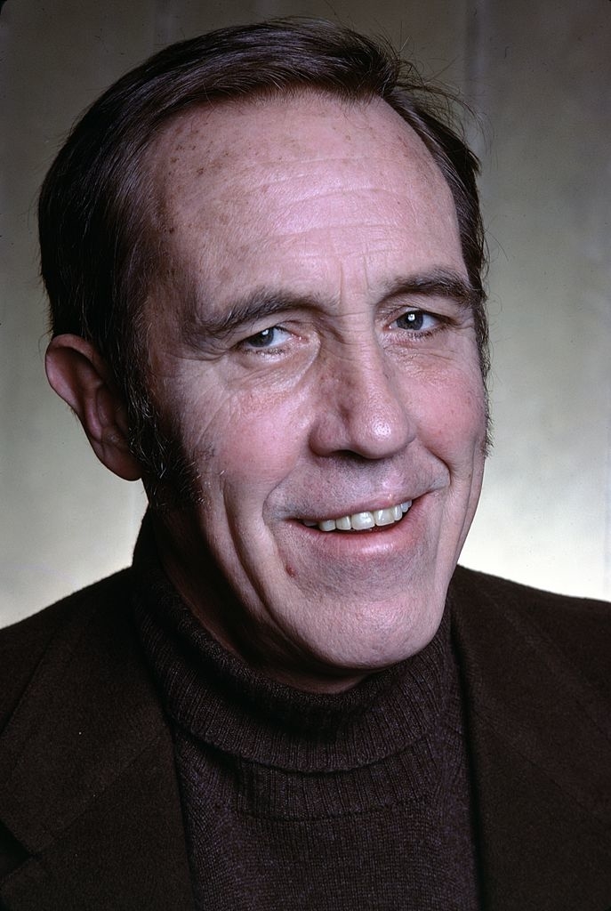 Robards as a younger man with clean shaven face and a mock turtleneck sweater