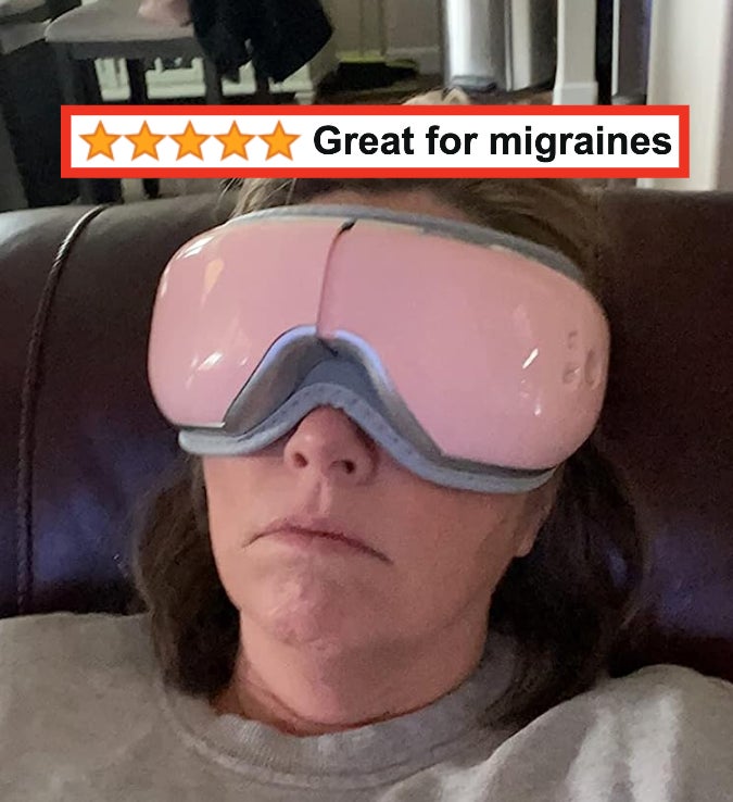 Reviewer using their pink eye massager with words &quot;Great for migraines&quot;