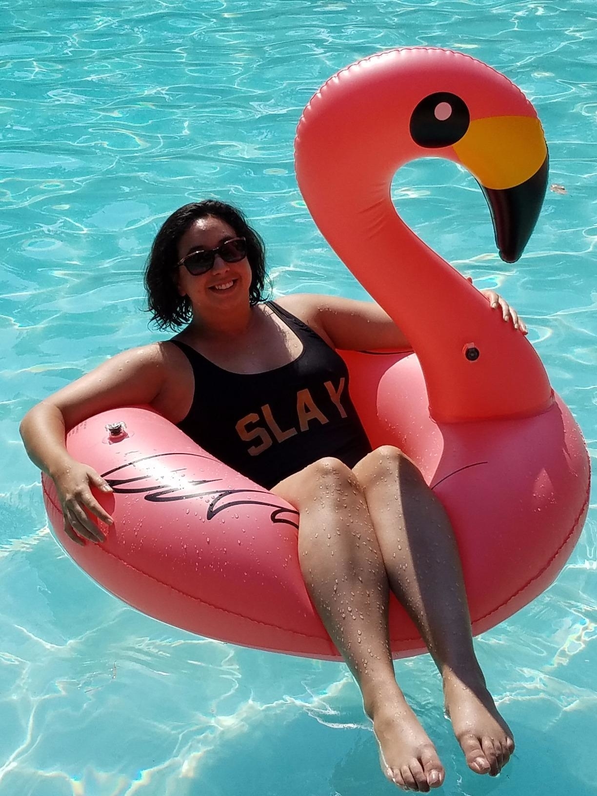 a reviewer in the pink float in a pool