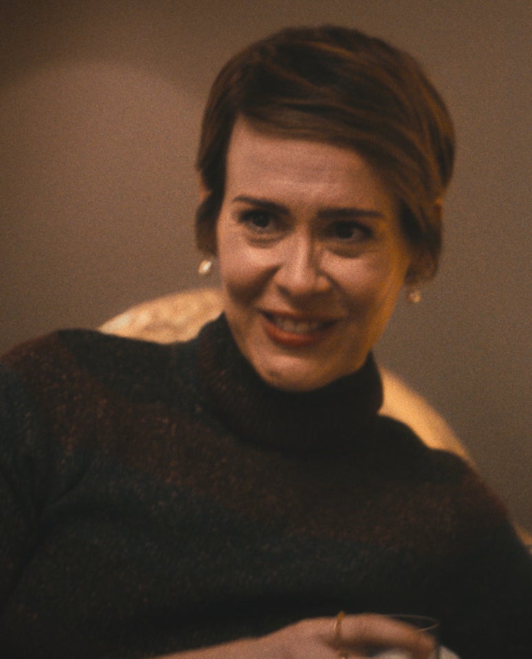 Sarah Paulson wearing a black sweater with a short haircut in The Bear