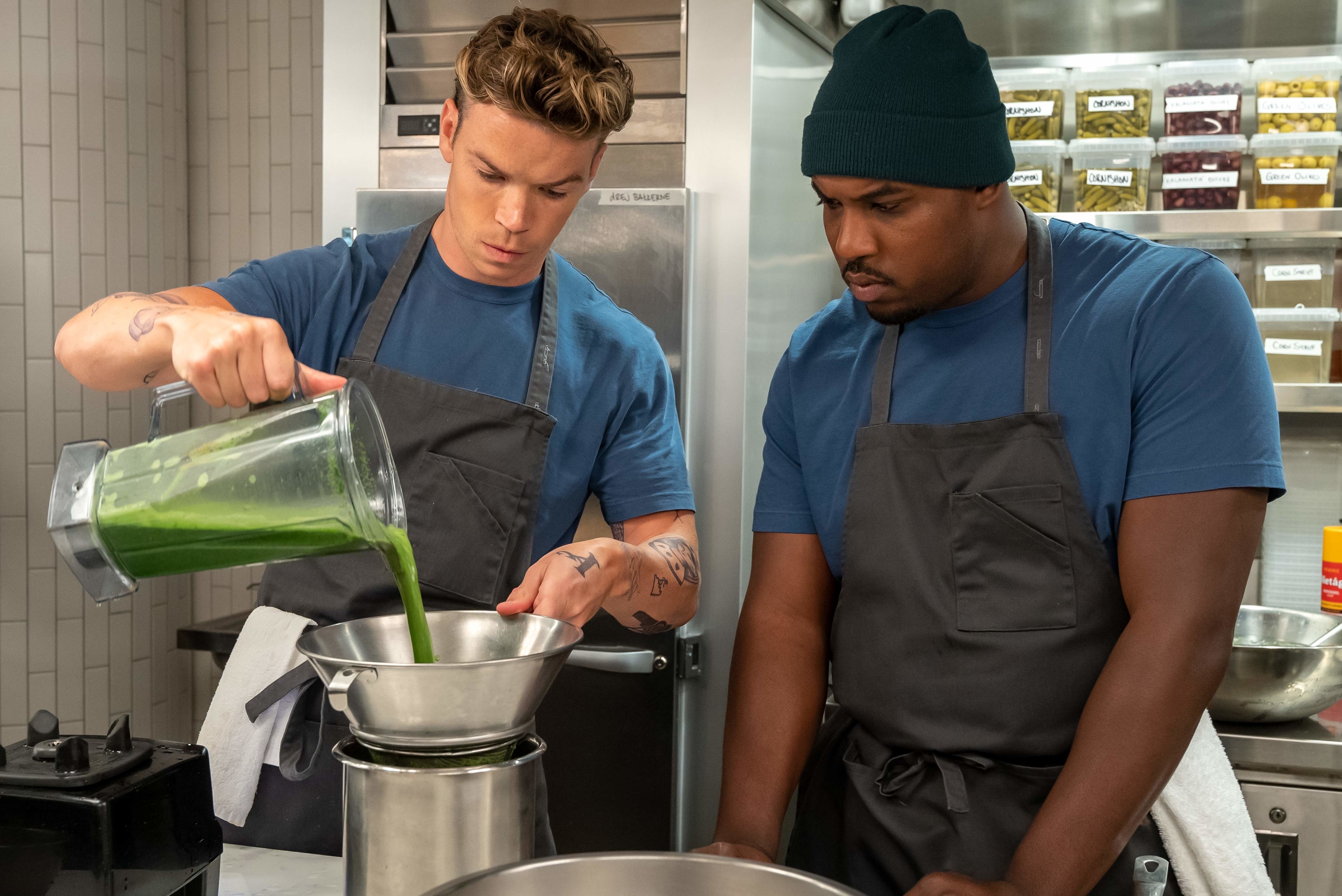 Will Poulter cooking in a kitchen alongside Lionel Boyce in The Bear