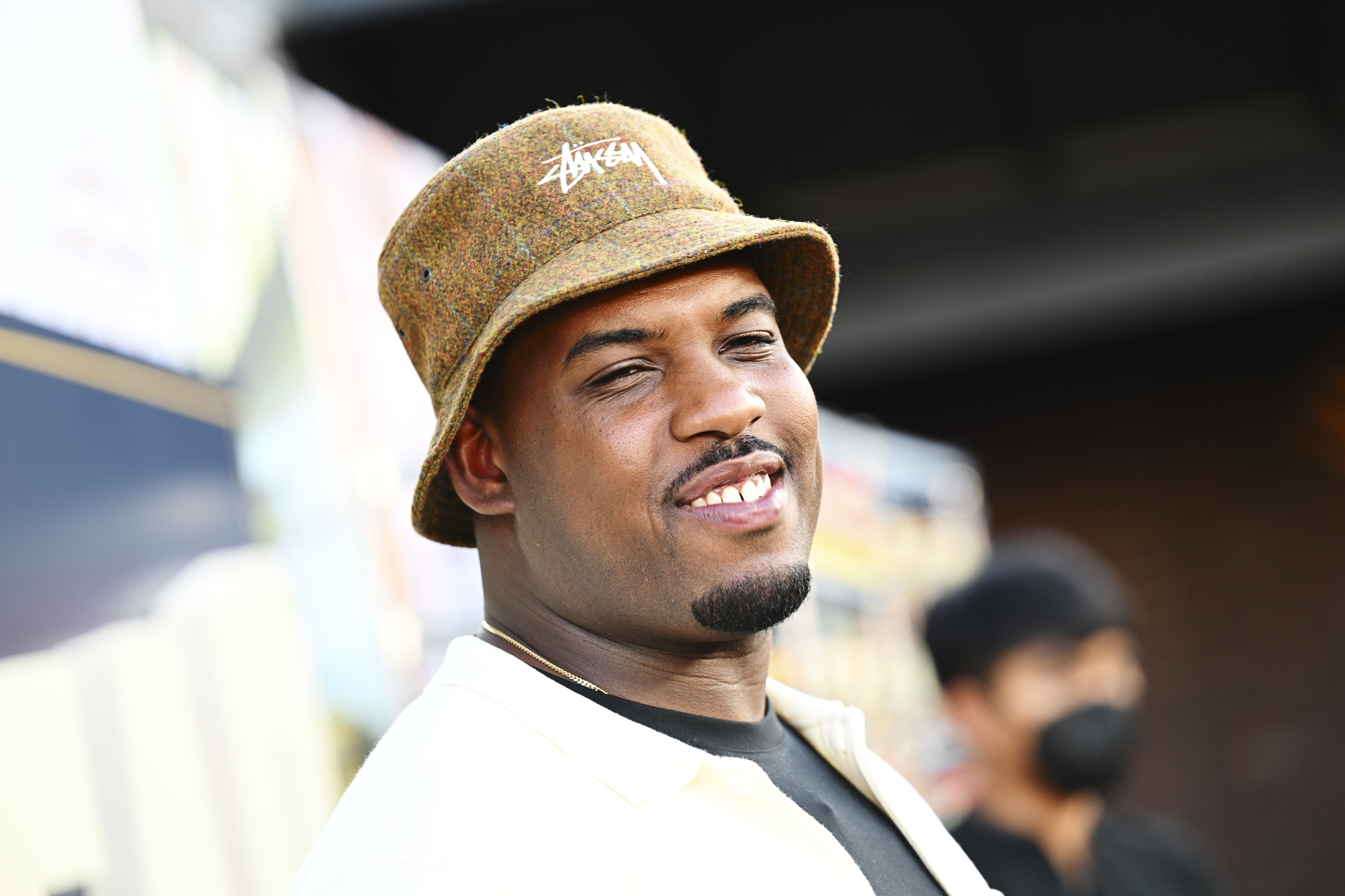 Lionel Boyce at the premiere of FX&#x27;s The Bear wearinf a bucket hat. Lionel has a mustache and a goatee