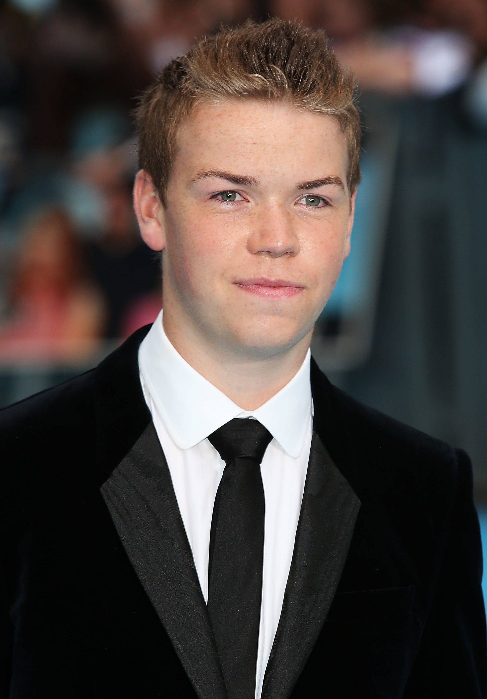 Will Poulter in a suit and tie and short hair