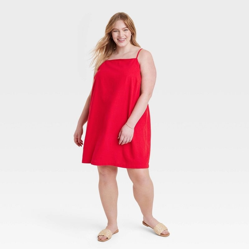Model wearing the red sundress